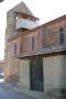 Iglesia del pueblo con su torre en forma de espadaña y sus torres exteriores forradas de canto rodado. Esta iglesia es una de las más bonitas de la Sobarriba
